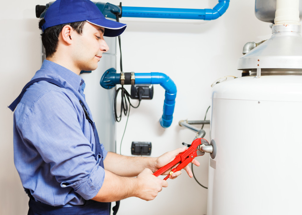 Plumber repairing an hot-water heater