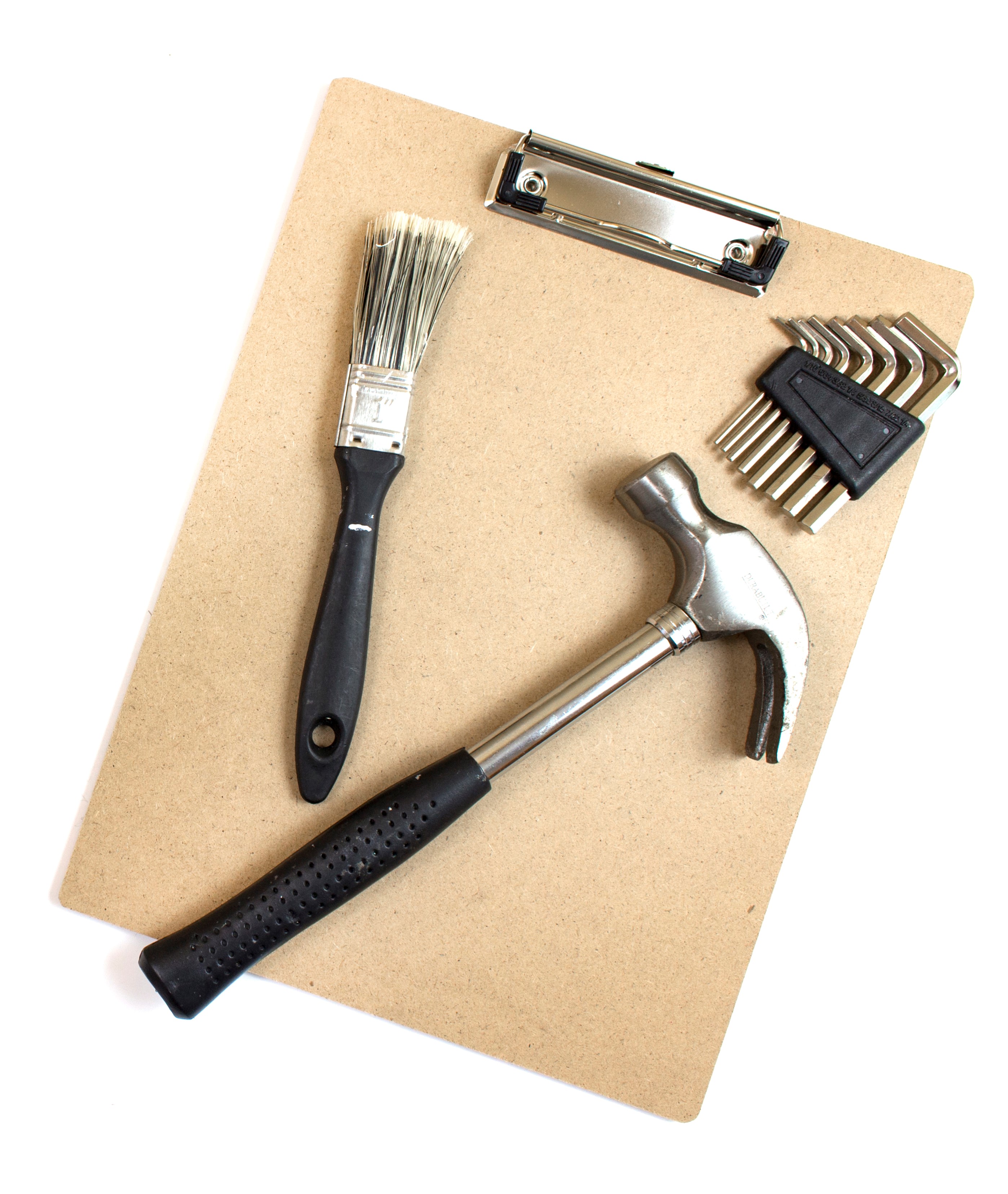 hammer paintbrush hex screw drivers on a clipboard