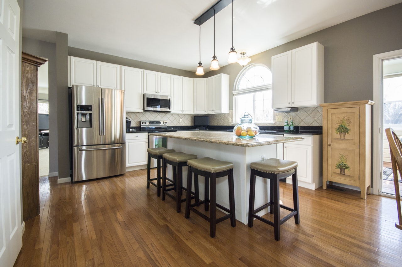 kitchen with wood floor pendant lighting grey walls